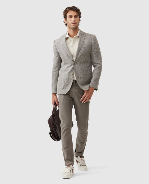 Rodd & Gunn - Cascades Jacket - Mink worn by a model, paired with casual trousers and carrying a bag.