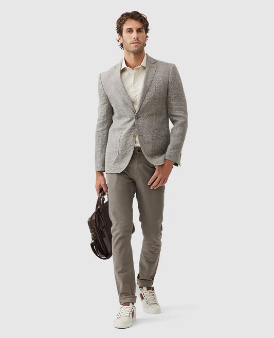 Rodd & Gunn - Cascades Jacket - Mink worn by a model, paired with casual trousers and carrying a bag.