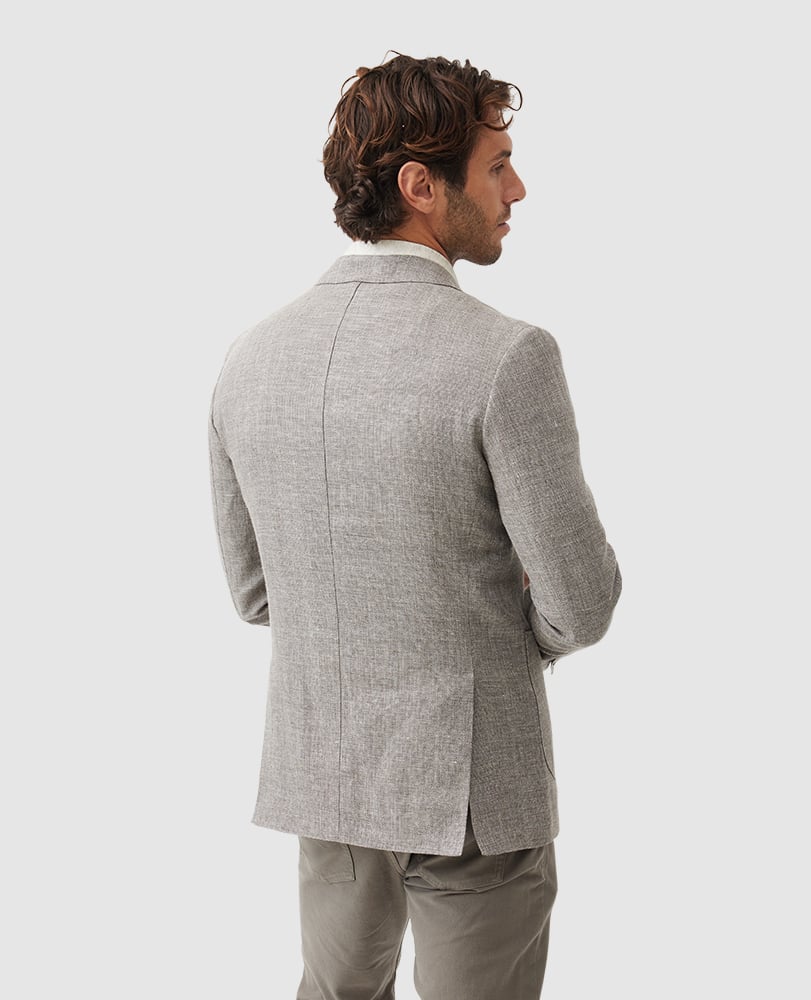 Rodd & Gunn - Cascades Jacket - Mink showcasing the back view of a stylish man in a textured grey jacket.