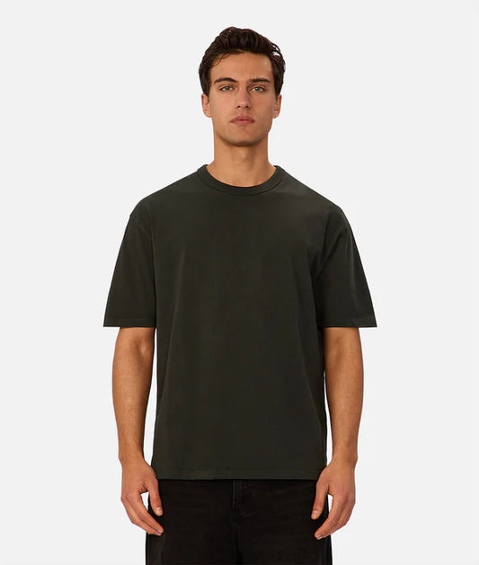 Industrie - The Del Sur Tee - Celtic - MULTIBUY, model wearing dark oversized t-shirt with relaxed fit.