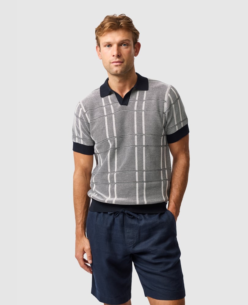 Rodd & Gunn - Dryden Bay Knit Polo - Eclipse in grey check pattern, model wearing relaxed style with navy shorts.