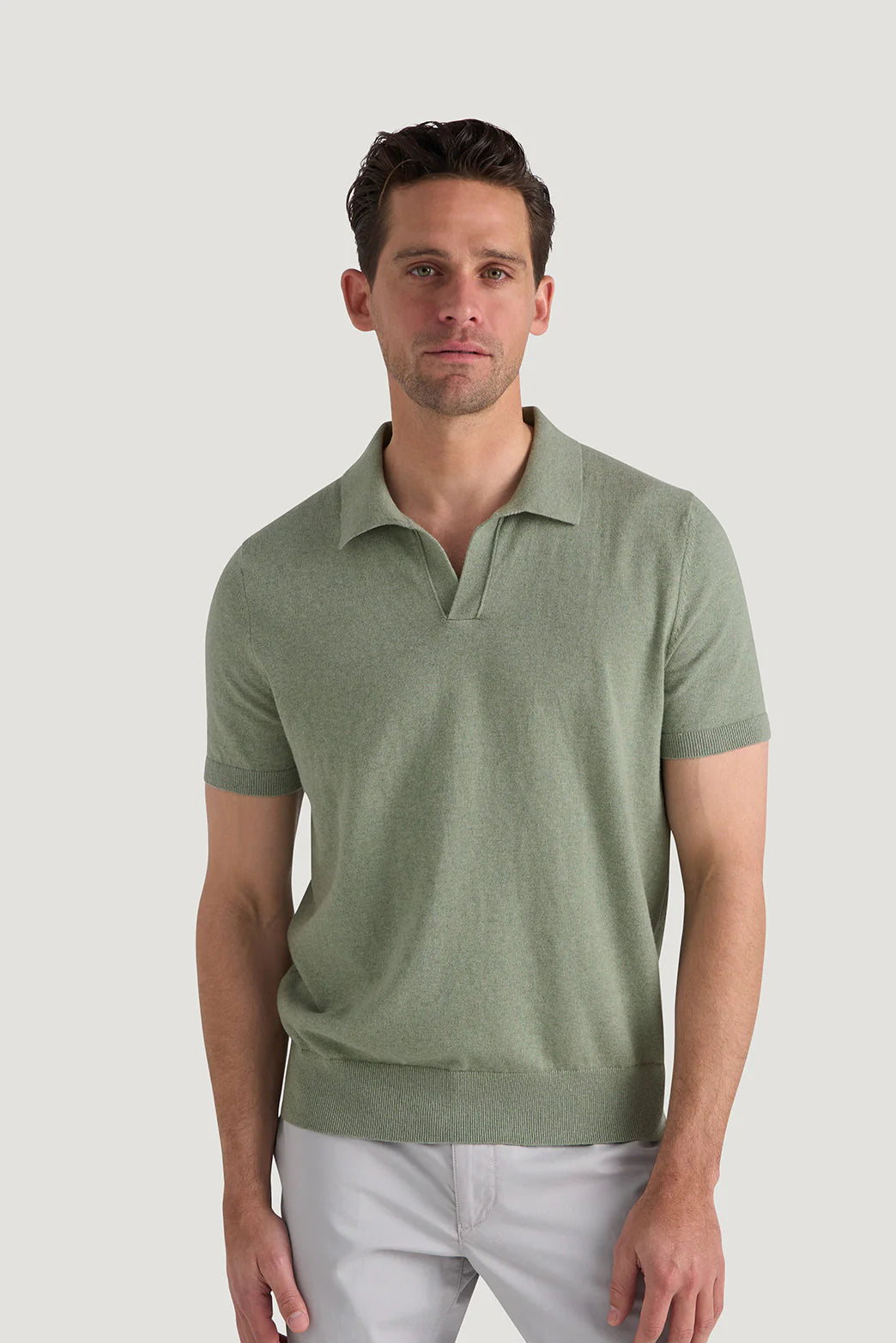 M.J. Bale - Furlong Polo - Cotton/Cashmere Blend - Vintage Sage Melange modeled by a man in a casual setting.