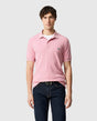 Rodd & Gunn - The Gunn Polo - Coral - MULTIBUY worn by a model, showcasing its modern design and sports fit.