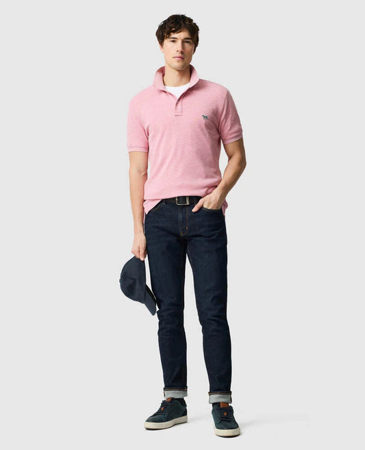 Rodd & Gunn - The Gunn Polo - Coral - MULTIBUY worn by a model with denim jeans and a hat, showcasing casual style.