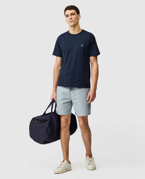 Rodd & Gunn - The Gunn T-Shirt 2.0 - Midnight - MULTIBUY worn by a model with a duffel bag and shorts.