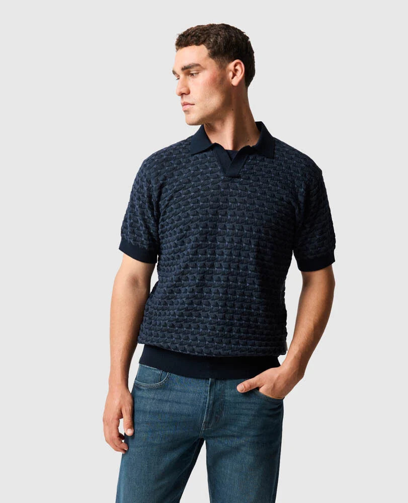 Rodd & Gunn - Halken Knit Polo - Midnight showcased on a model, featuring a two-tone geometric knit pattern.