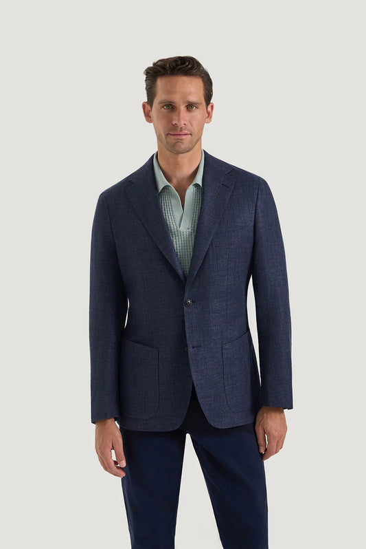 M.J. Bale - Hannigan Jacket - Navy worn by a man standing confidently in a stylish setting.
