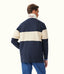 Man wearing a navy and beige striped shirt with a visible brand logo on a white background