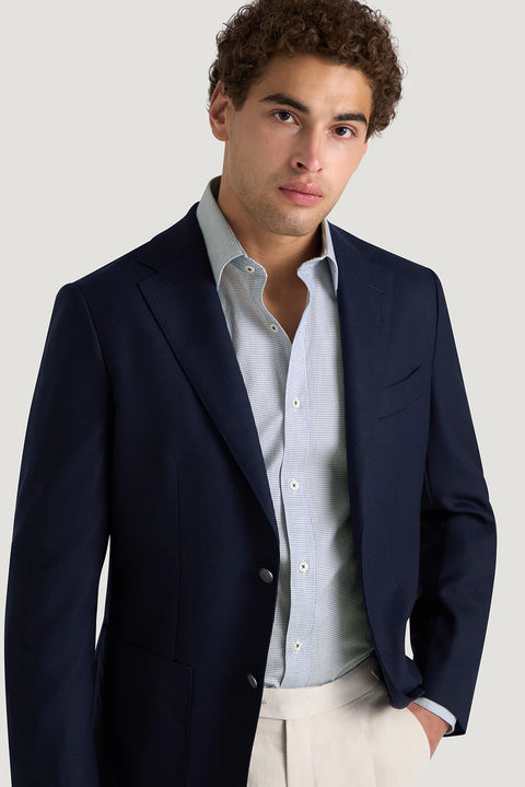 M.J. Bale - Hewitt Shirt - Dobby Weave - Navy - MULTIBUY worn under a navy blazer, showcasing refined style and elegance.