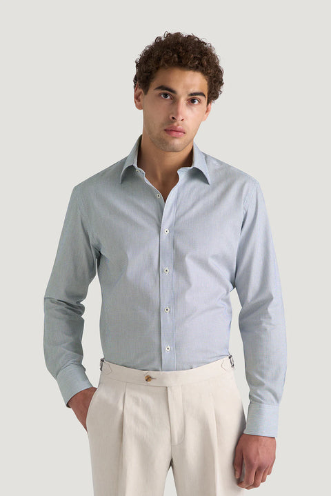 M.J. Bale - Hewitt Shirt - Dobby Weave - Navy - MULTIBUY modeled by a man in a tailored outfit.