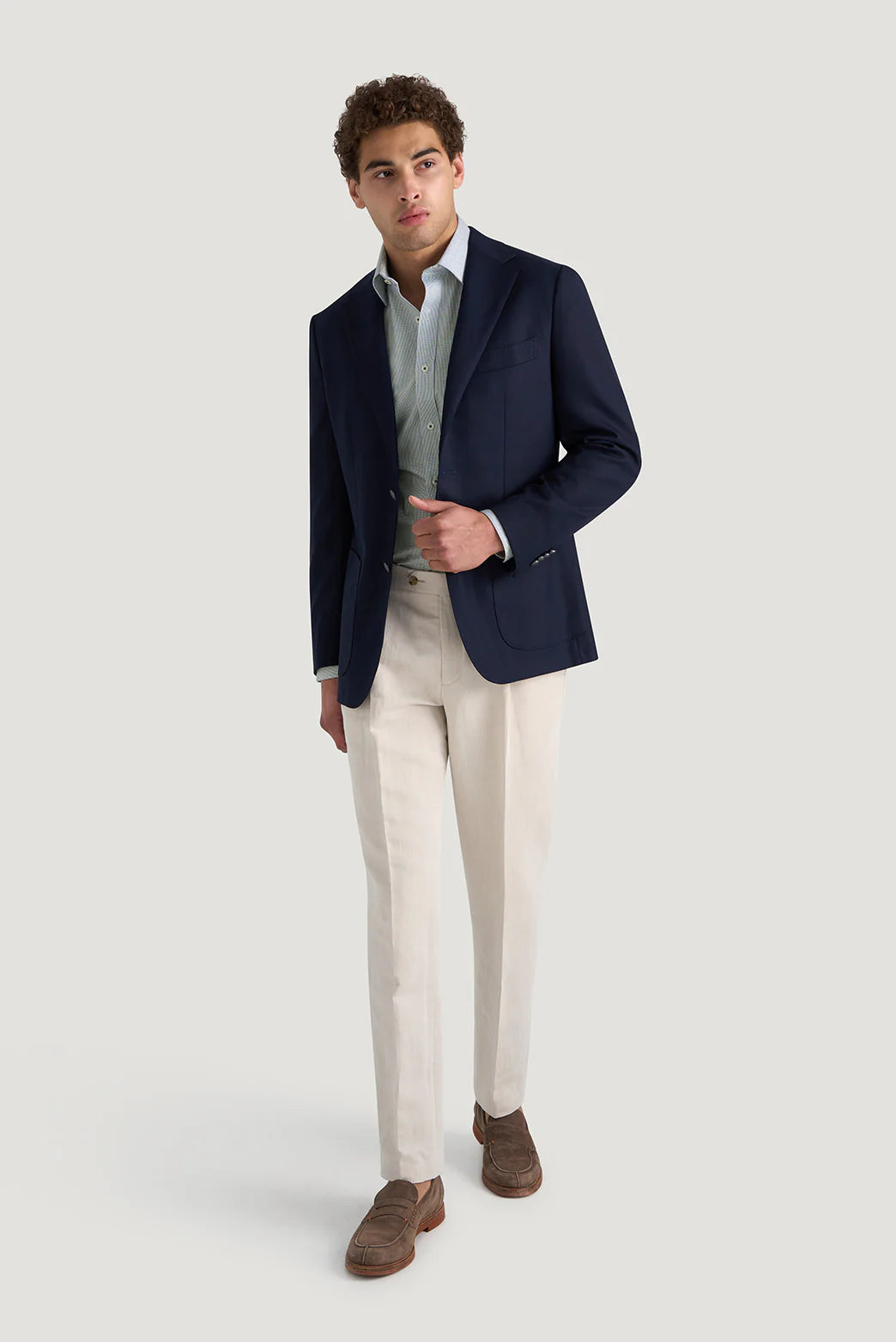 M.J. Bale - Hewitt Shirt - Dobby Weave - Navy - MULTIBUY worn with a navy blazer and cream trousers, showcasing an elegant outfit.
