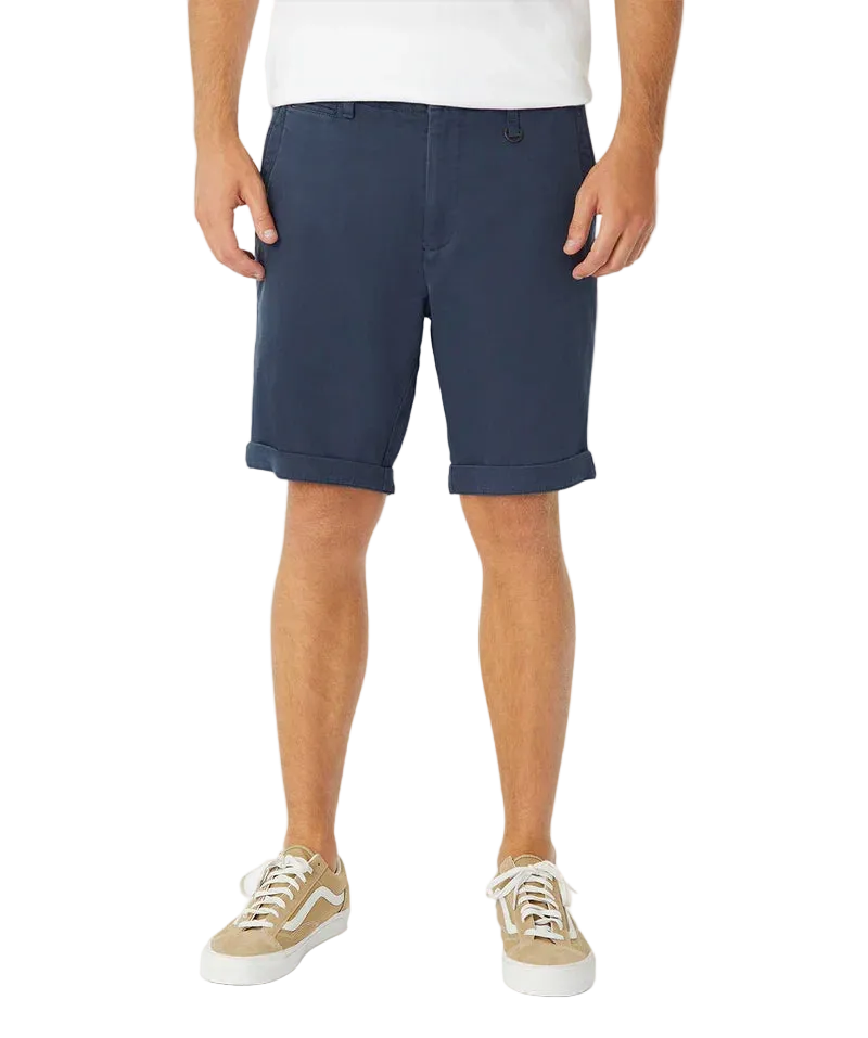 Person wearing navy shorts on a white background