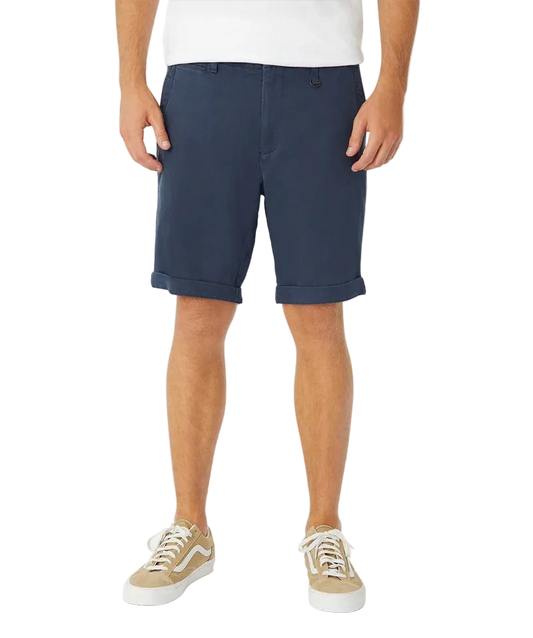 Person wearing navy shorts on a white background