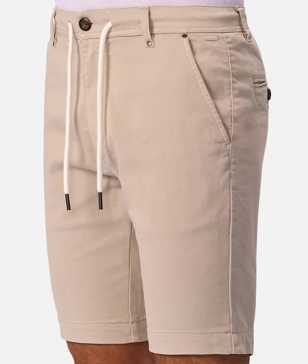 Beige drawstring shorts with a button closure, belt loops, and side pockets, shown on a model against a light gray background.