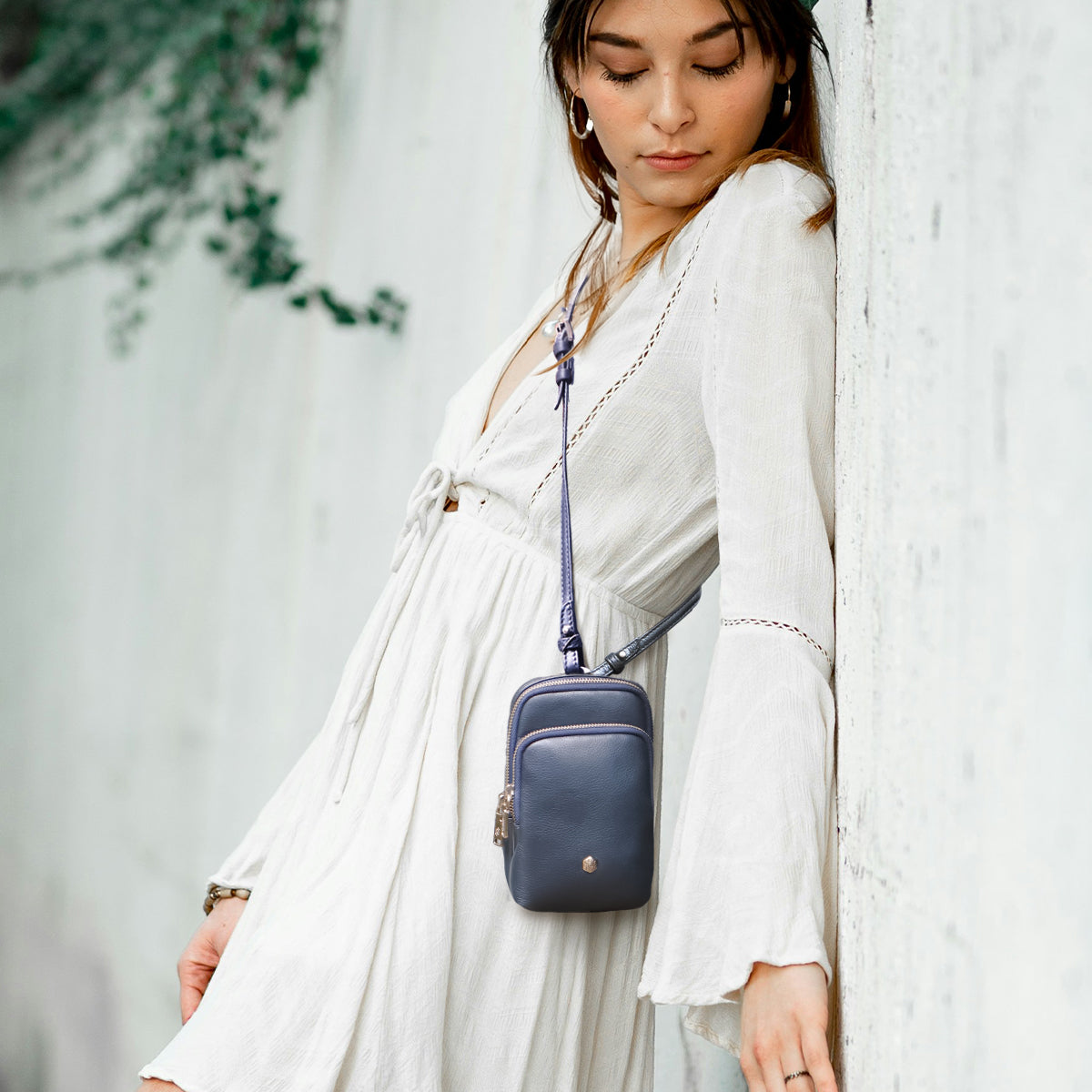 Jekyll and Hide - Womens Small Mobile Phone Sling Purse - Mulitple Colours worn crossbody by a model in a white dress.