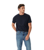 A man wearing a dark navy blue crewneck t-shirt with a small red embroidered logo on the left chest, paired with blue jeans, photographed against a solid white background.