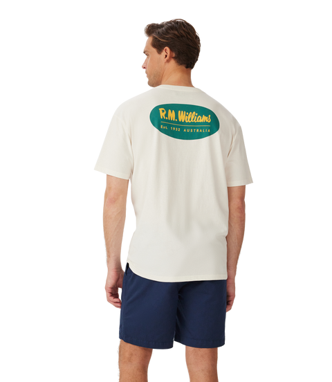 Model showcasing the R.M.Williams - 90s Logo T-Shirt - White from the back, featuring classic logo design.