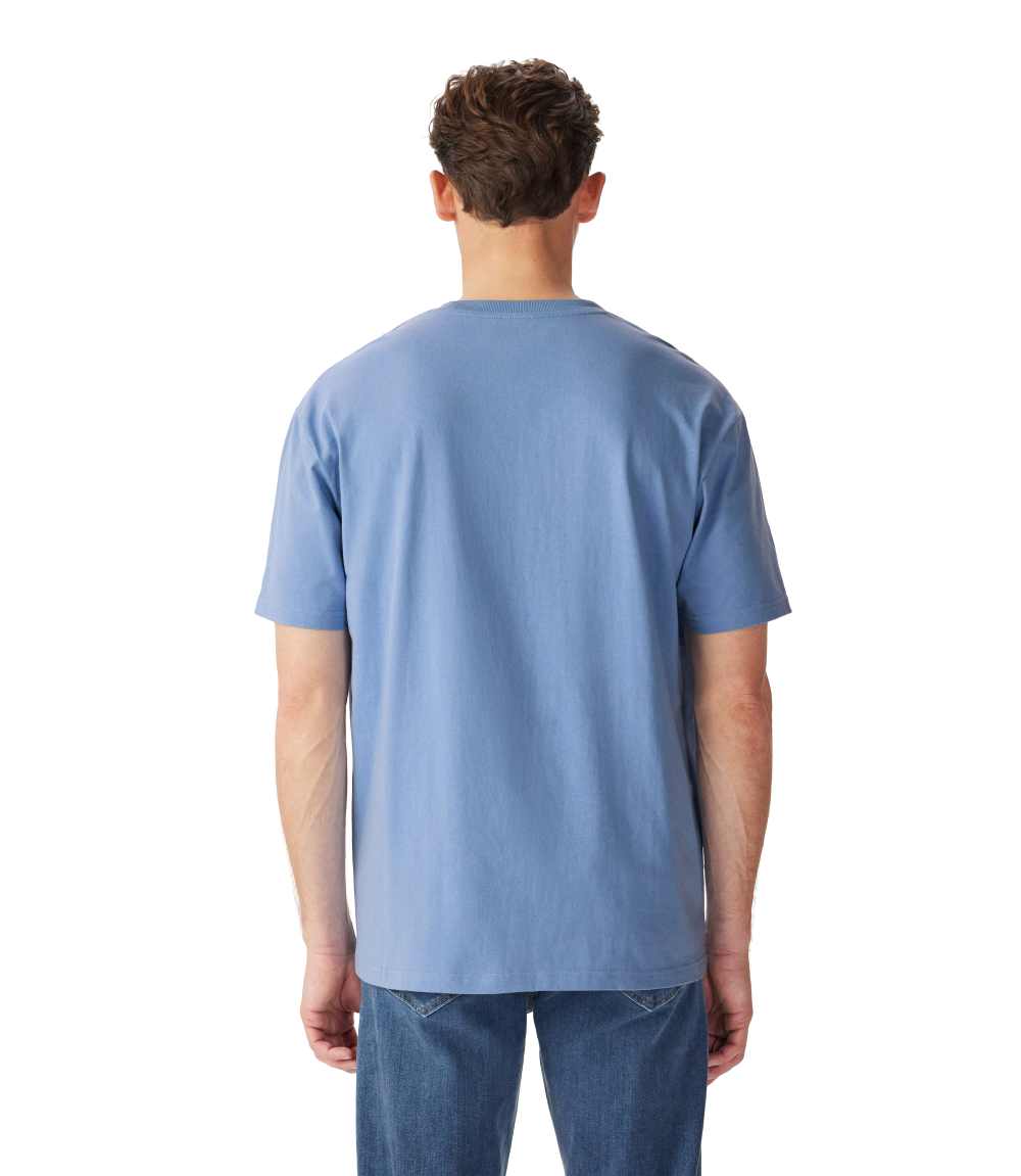 R.M.Williams - Outfitter T-Shirt - Soft Blue, back view of a man wearing the t-shirt in soft blue color.