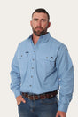 Ringers Western - King River Work Shirt - Blue Denim modeled by a man, showcasing comfort and functionality for outdoor work.
