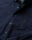 Navy blue shirt with a Rodd & Gunn logo on left chest