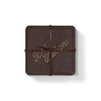 R.M.Williams - Script Logo 4 Piece Coaster Set - Russett displayed as a single piece wrapped with leather tie.