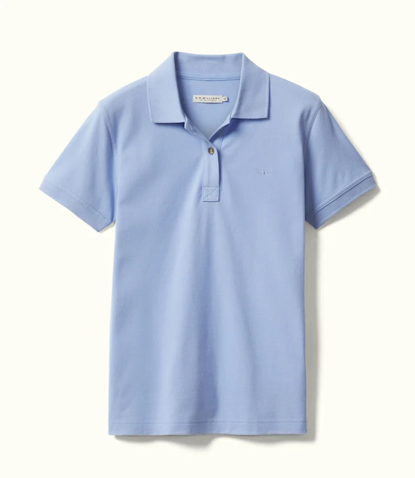 Close view of cotton piqué fabric and chest logo on polo shirt.