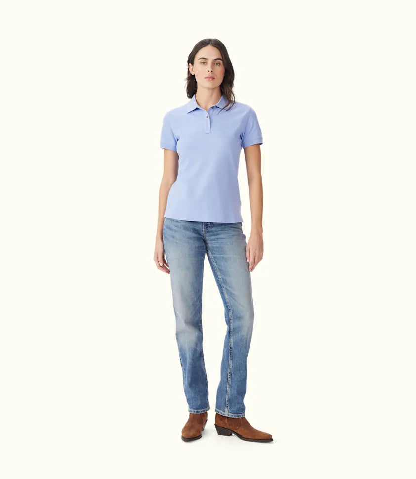 R.M.Williams women's polo shirt worn with denim jeans.