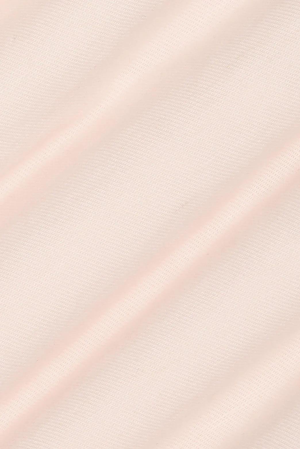 Close-up of soft pink fabric, showcasing texture, used in M.J. Bale - Menorca Side Tab Short- Pink.