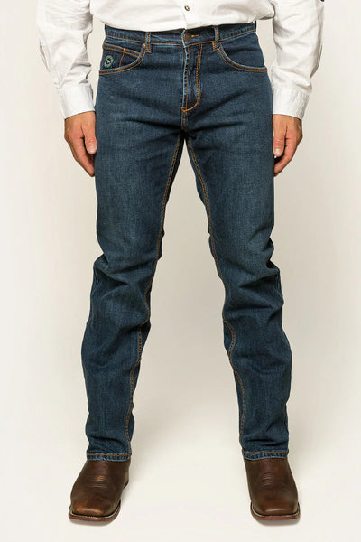 Ringers Western - Muster Slim Straight Fit Jeans- Dark Wash Blue worn by a model standing with hands in pockets.