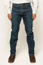 Ringers Western - Muster Slim Straight Fit Jeans- Dark Wash Blue worn by a model standing with hands in pockets.