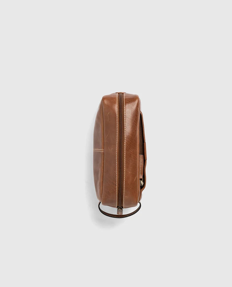 Rodd & Gunn - Princeton Washbag - Cognac side view showcasing quality leather craftsmanship and design.