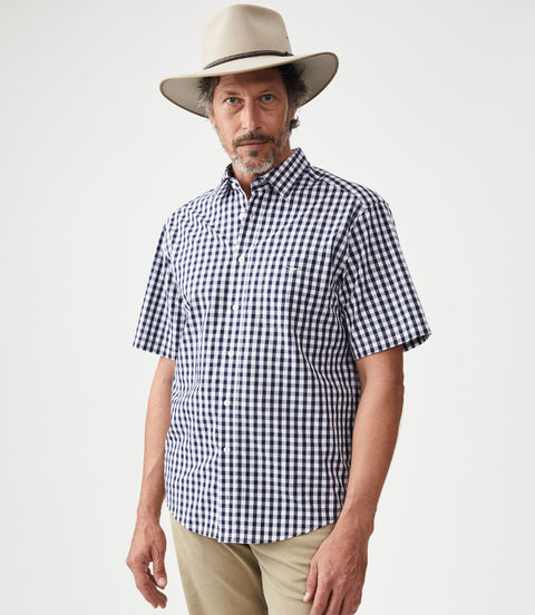 R.M.Williams - Hervey Shirt - Short Sleeve - Check - Navy & White worn by a model with a hat