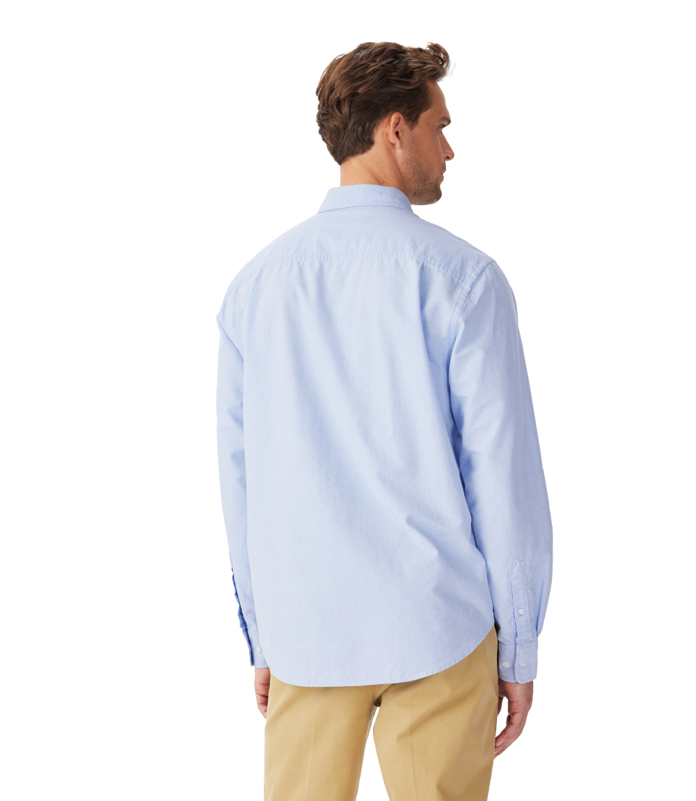 R.M.Williams - Collins Shirt - Oxford - Light Blue worn by a man from the back, showcasing its classic fit and light blue color.