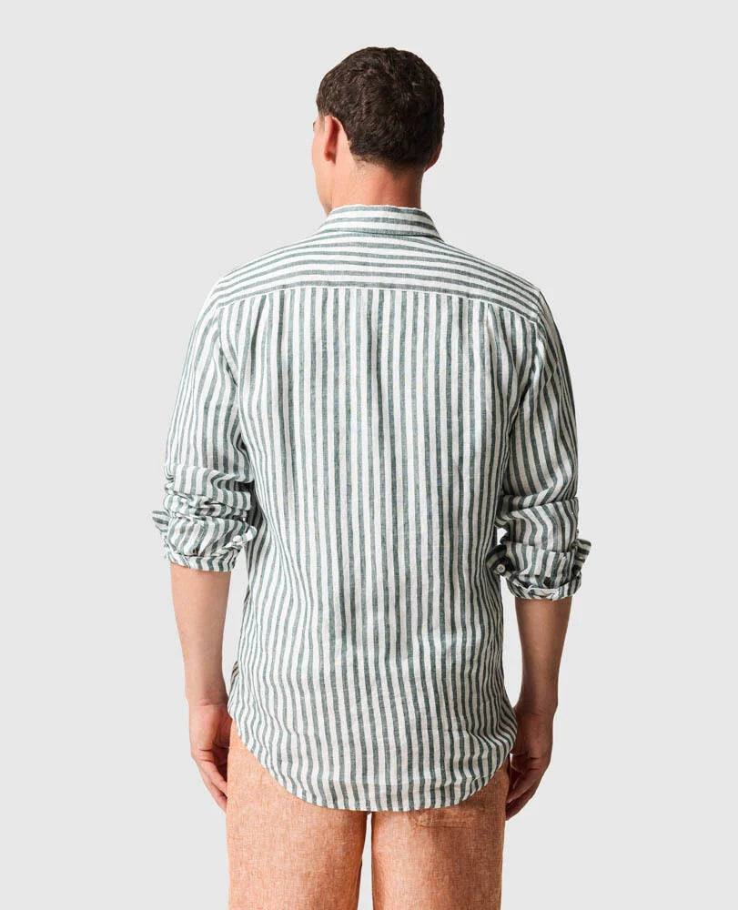 Back view of a man wearing the Rodd & Gunn - Seadown Linen Shirt - Stripe - Forest, showcasing vertical stripes.