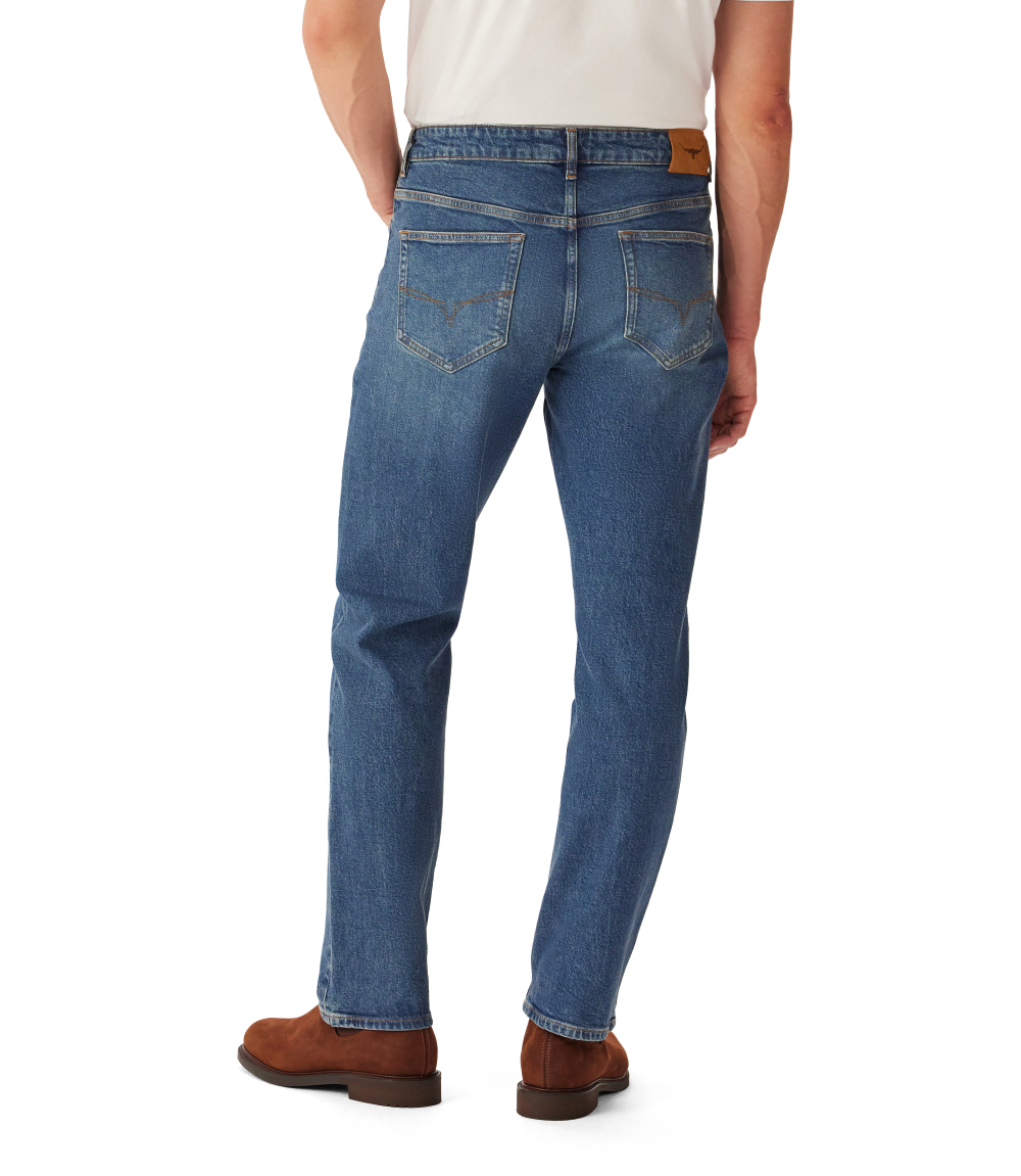 R.M.Williams - Ramco Jean - Vintage Indigo showcasing the back view with five pockets and signature branded hardware.
