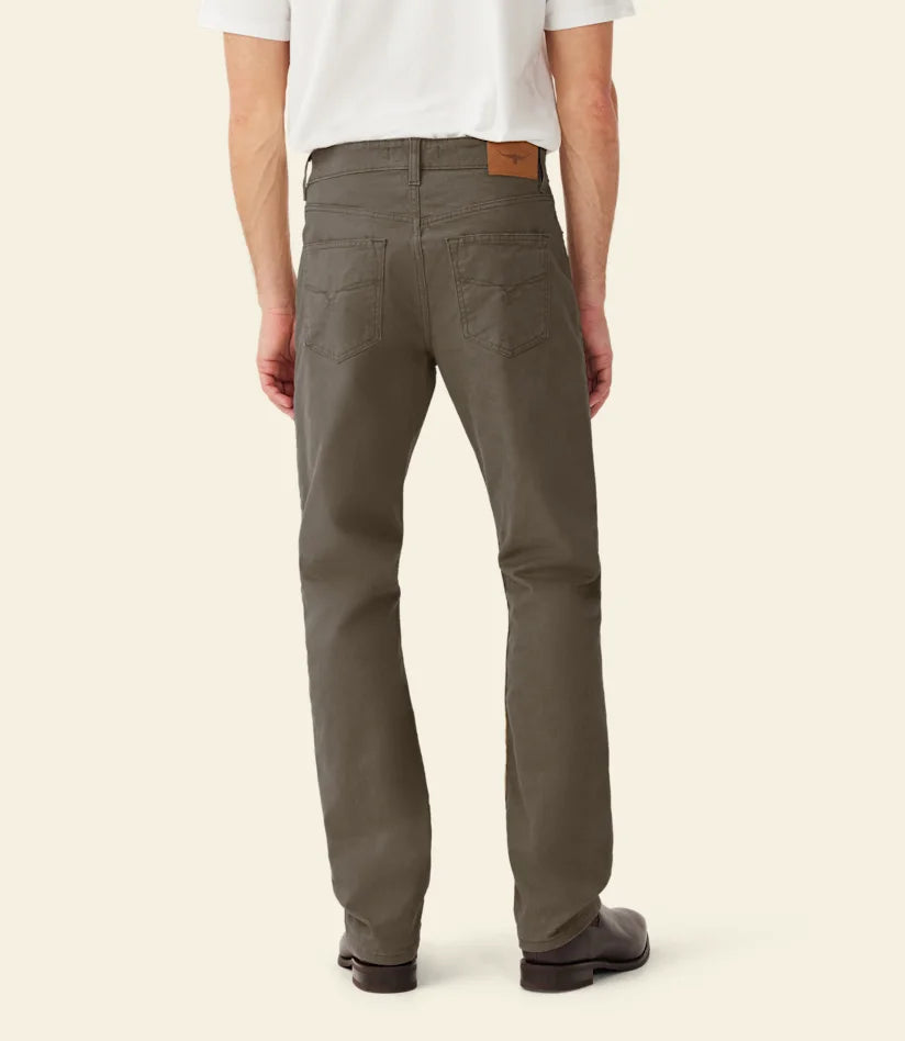 R.M.Williams - Ramco 5 Pocket Jean - Silt, showcasing the back view of a man wearing stylish straight-leg jeans.