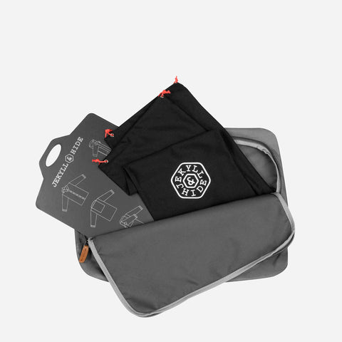 Jekyll and Hide - Shirt & Laundry Travel Bag - Grey displayed with a black laundry bag and organization tag.