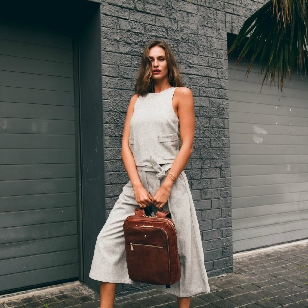 Model showcasing Jekyll and Hide - Ladies Business Backpack 38cm - Black | Tan in urban setting.